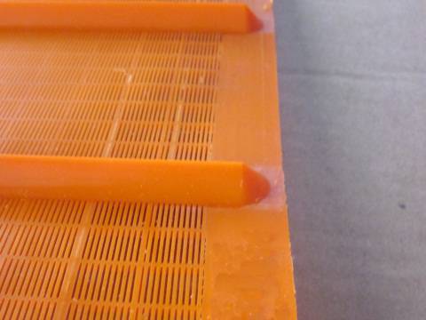 An orange fine polyurethane shale shaker screen.
